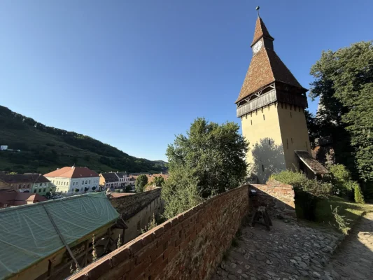 Biertan fortified church and defensive towers rising above the historic village