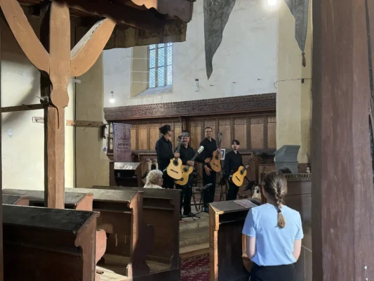 Romanian classical guitar ensemble performing inside Biertan fortified church