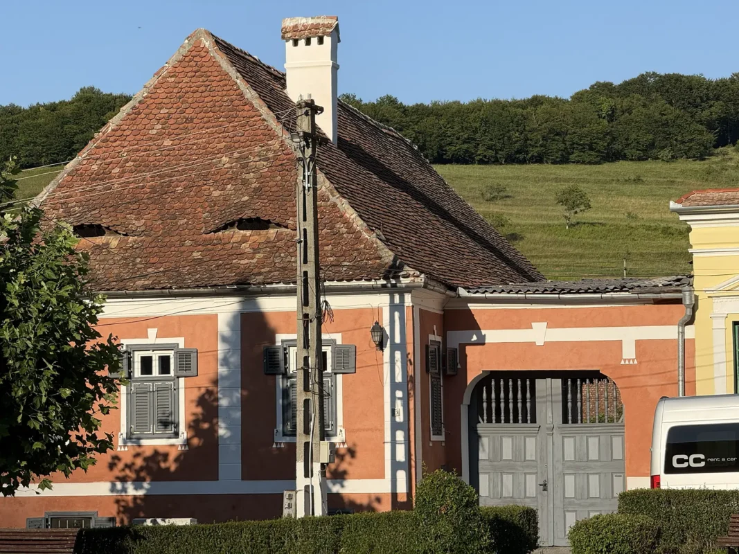 Traditional Saxon house in Biertan with paired eyebrow dormers resembling eyes in its tiled roof