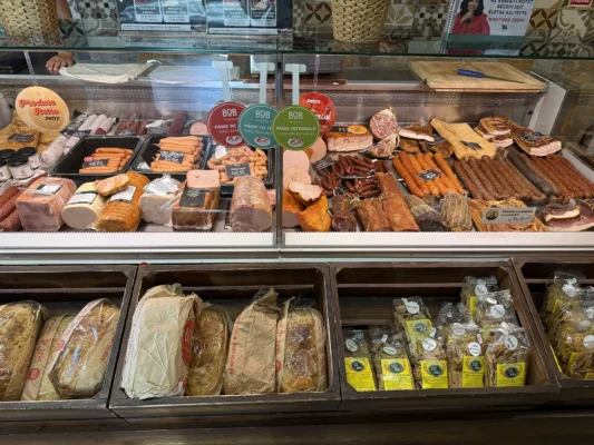 Petry butcher shop counter with traditional sausages, salami and cured meats in Târgu Mureș